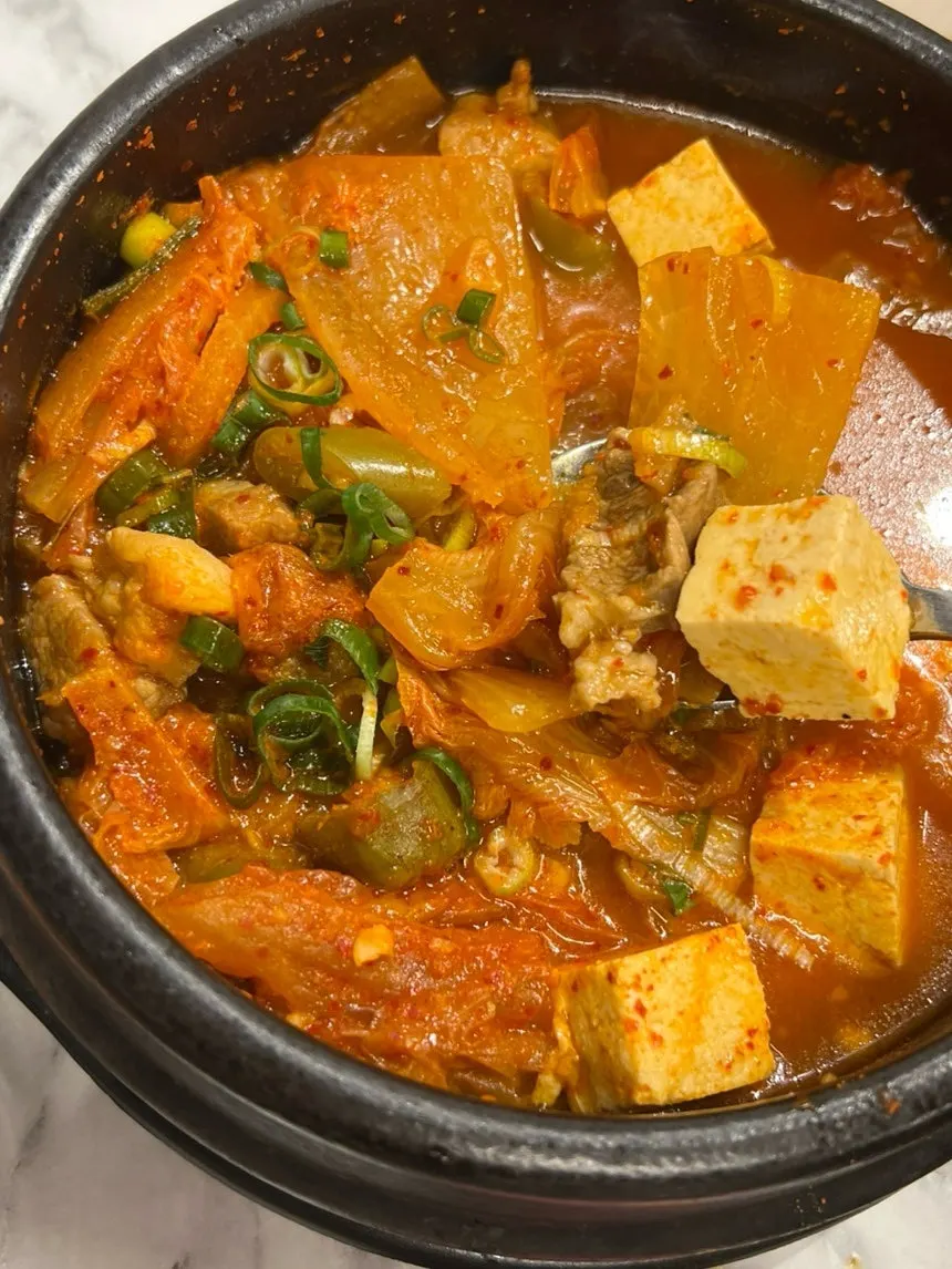 Broth with tofu and black pork in the kimchi jjigae