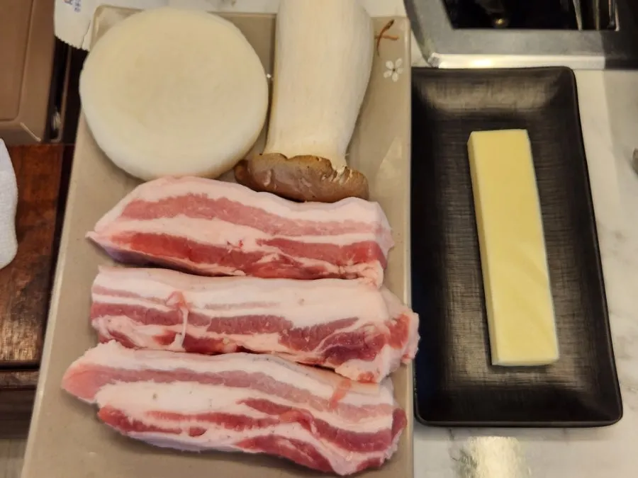 A thick plate of aged black pork belly