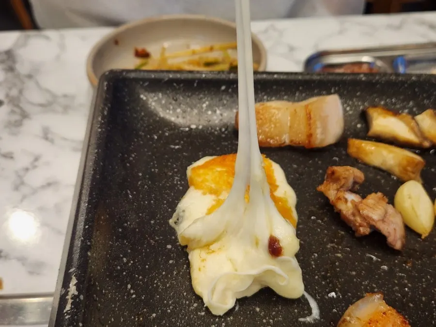 Grilled cheese stretching as it's pulled