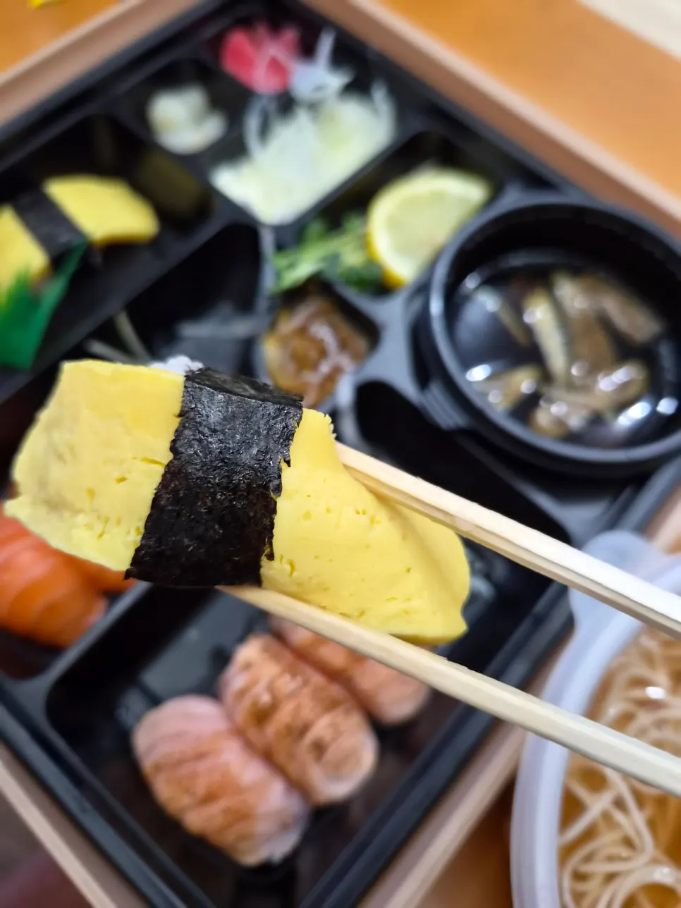 Sushi bento takeout container opened at the hotel