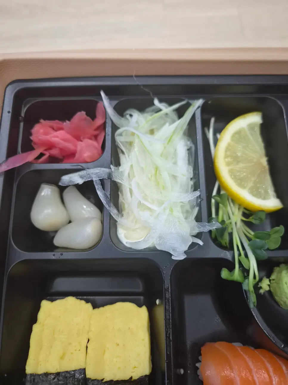 Close-up of sushi pieces in the bento