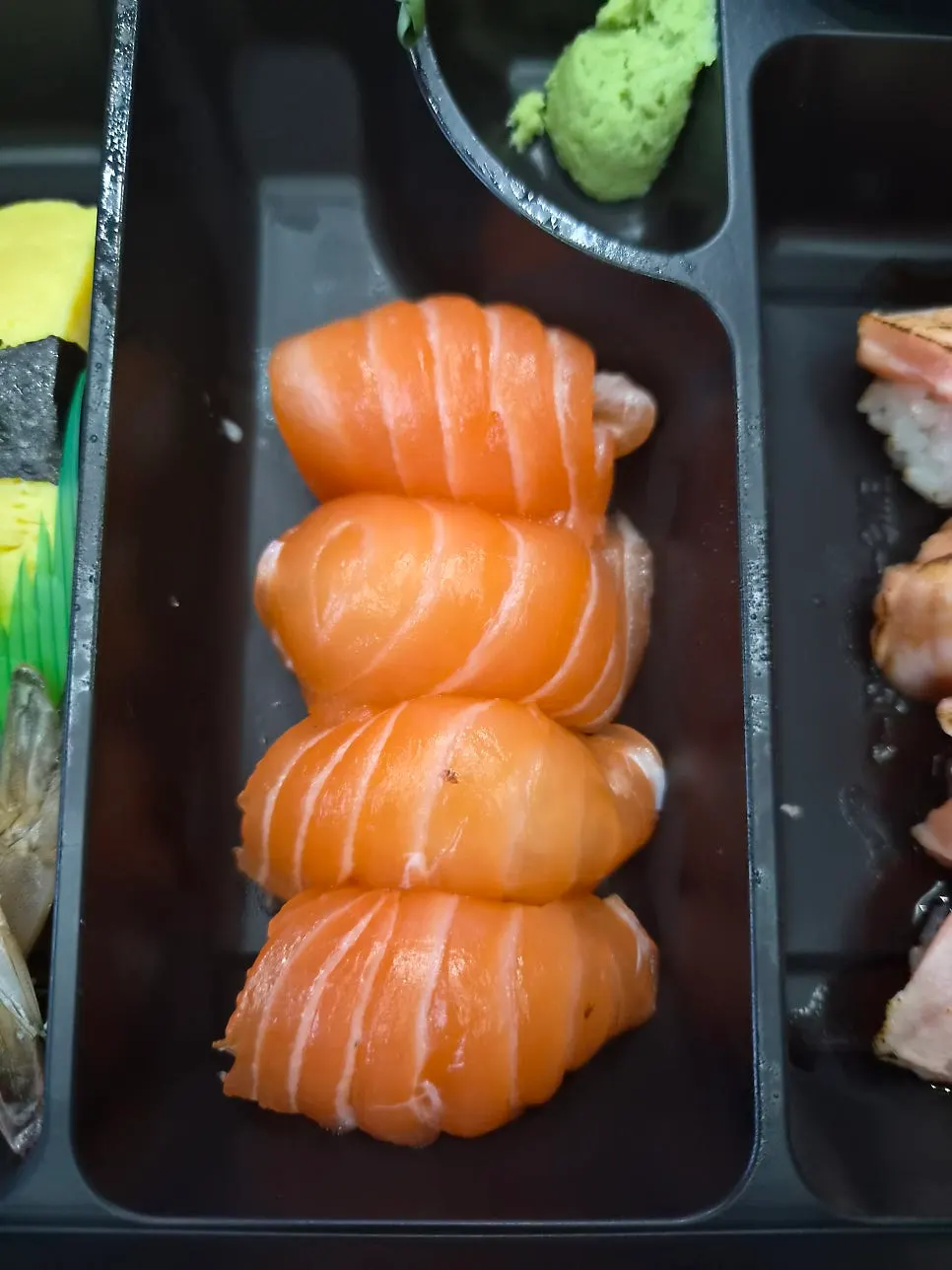 Sushi bento laid out on the hotel table