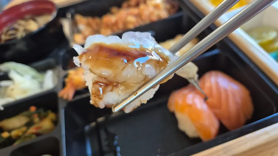 Three pieces of salmon sushi in the Jejju lunchbox