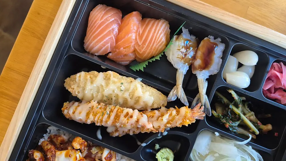 Raw shrimp sushi topped with sauce