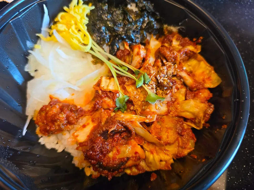 Jejju Donghong Branch lunchbox spread out on a table at the lodging