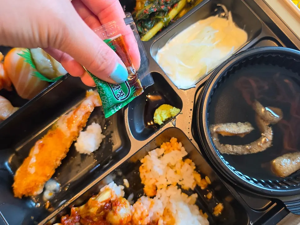 Salmon sushi served with soy sauce and wasabi