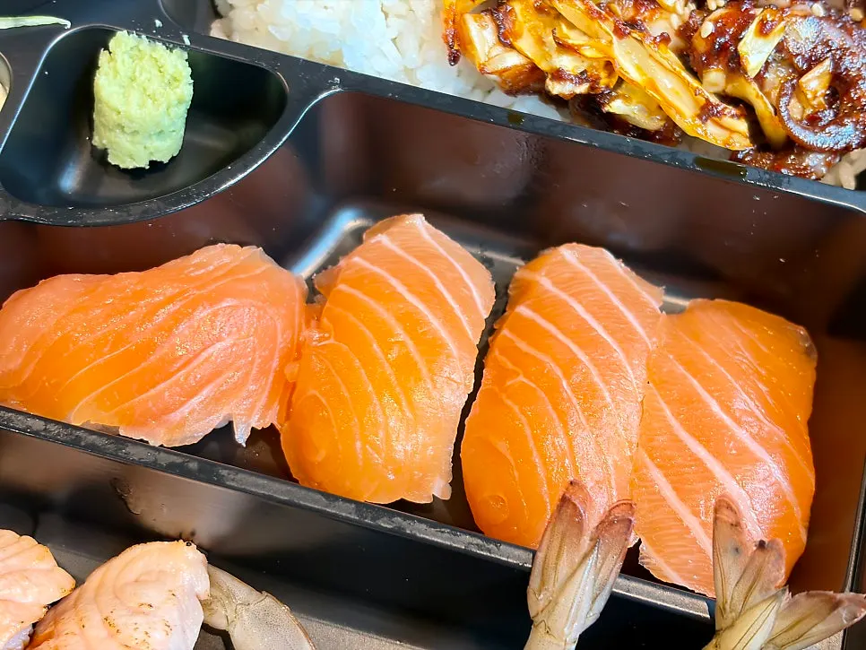 Grilled salmon sushi with a smoky char