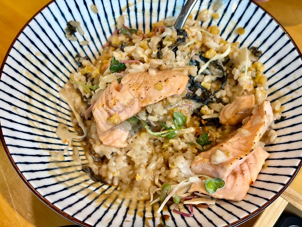 A spoonful of the salmon rice bowl