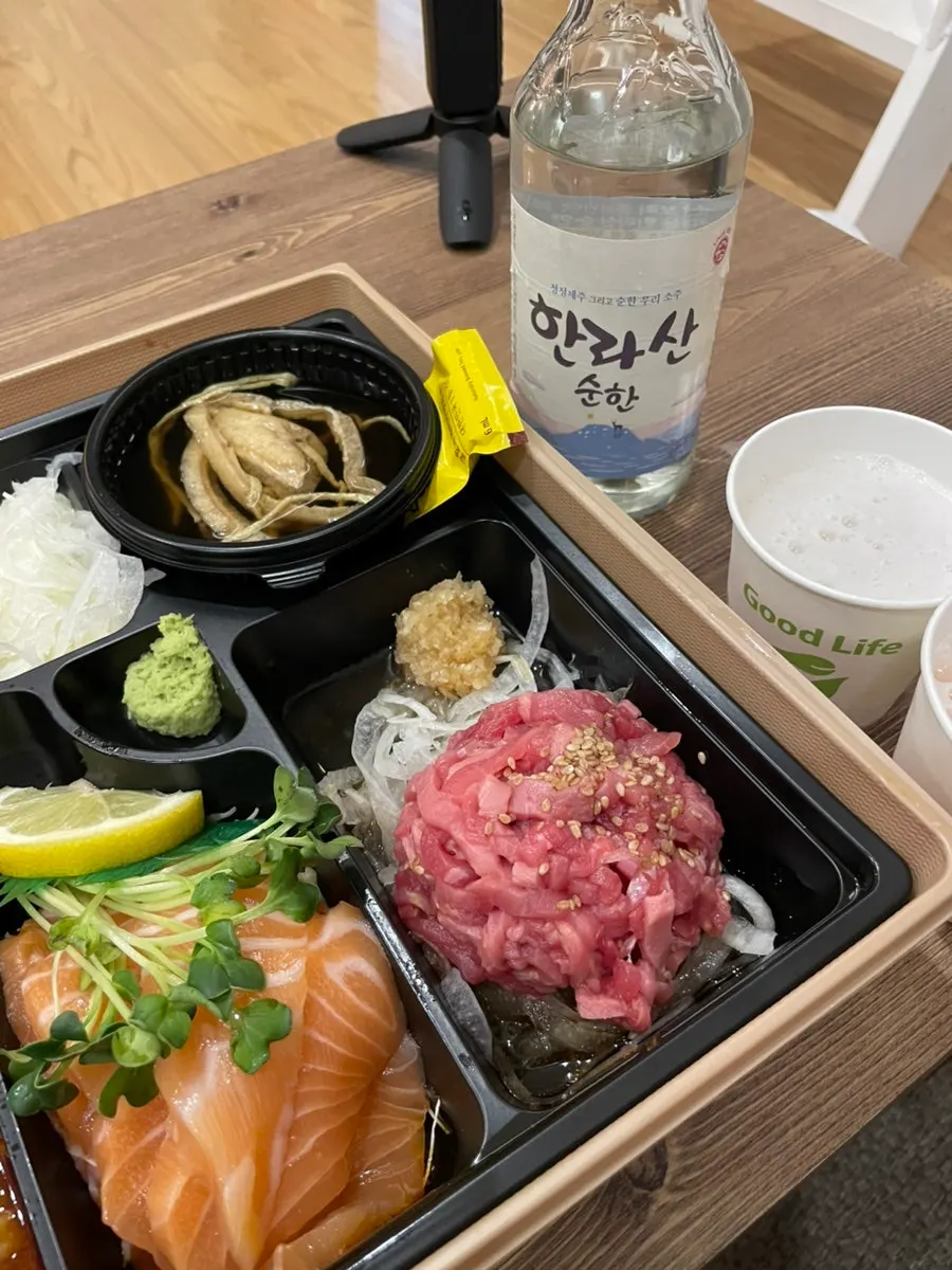 Jejju takeout lunchbox spread out at the accommodation