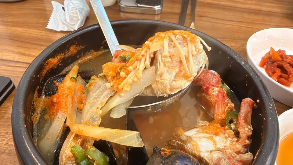 Seafood stew broth still bubbling