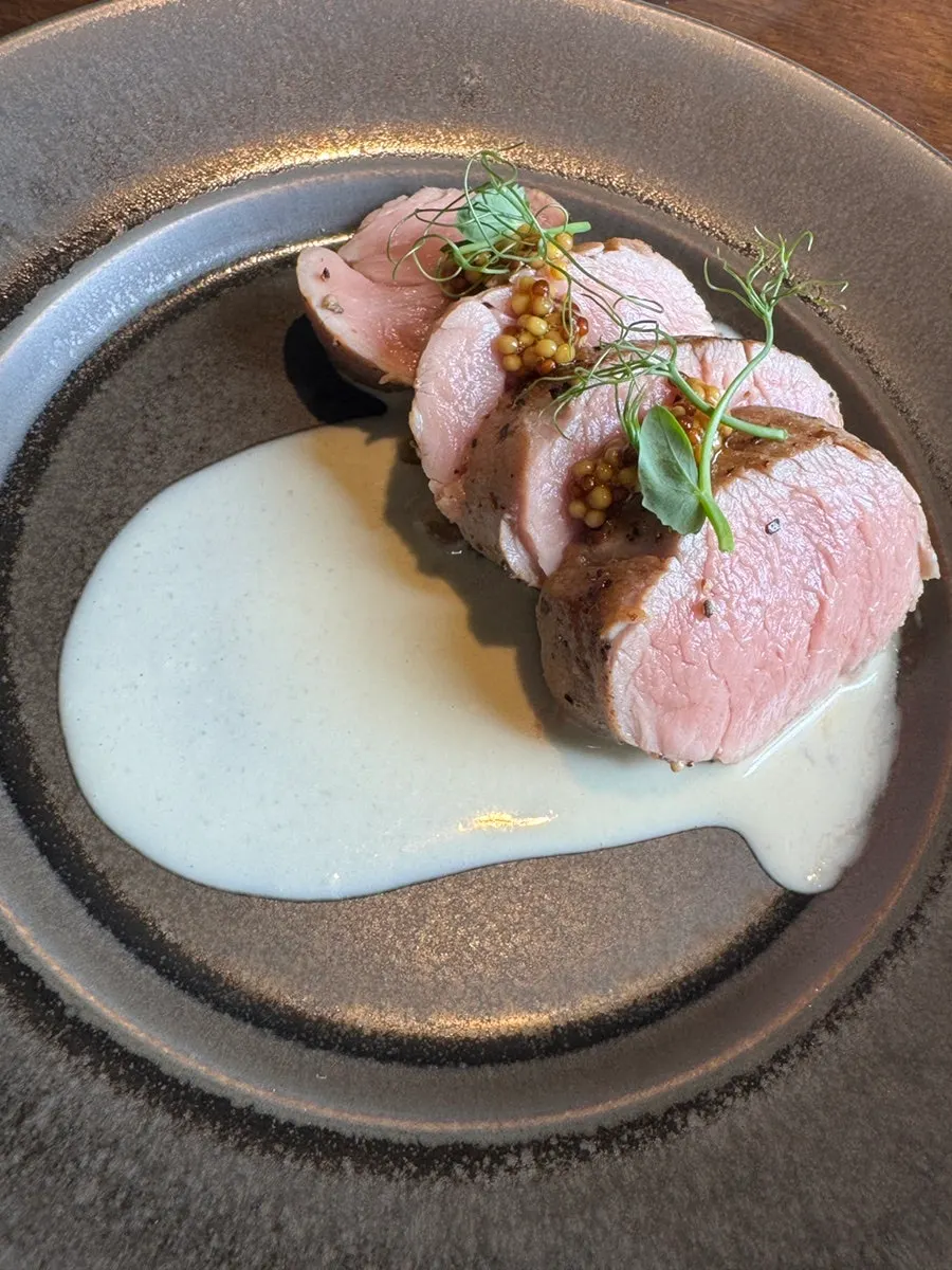 Close-up of the moist cross-section of the black pork tenderloin