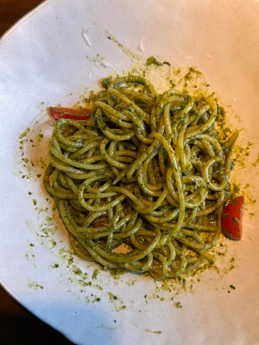 Vivid green basil pesto spaghetti