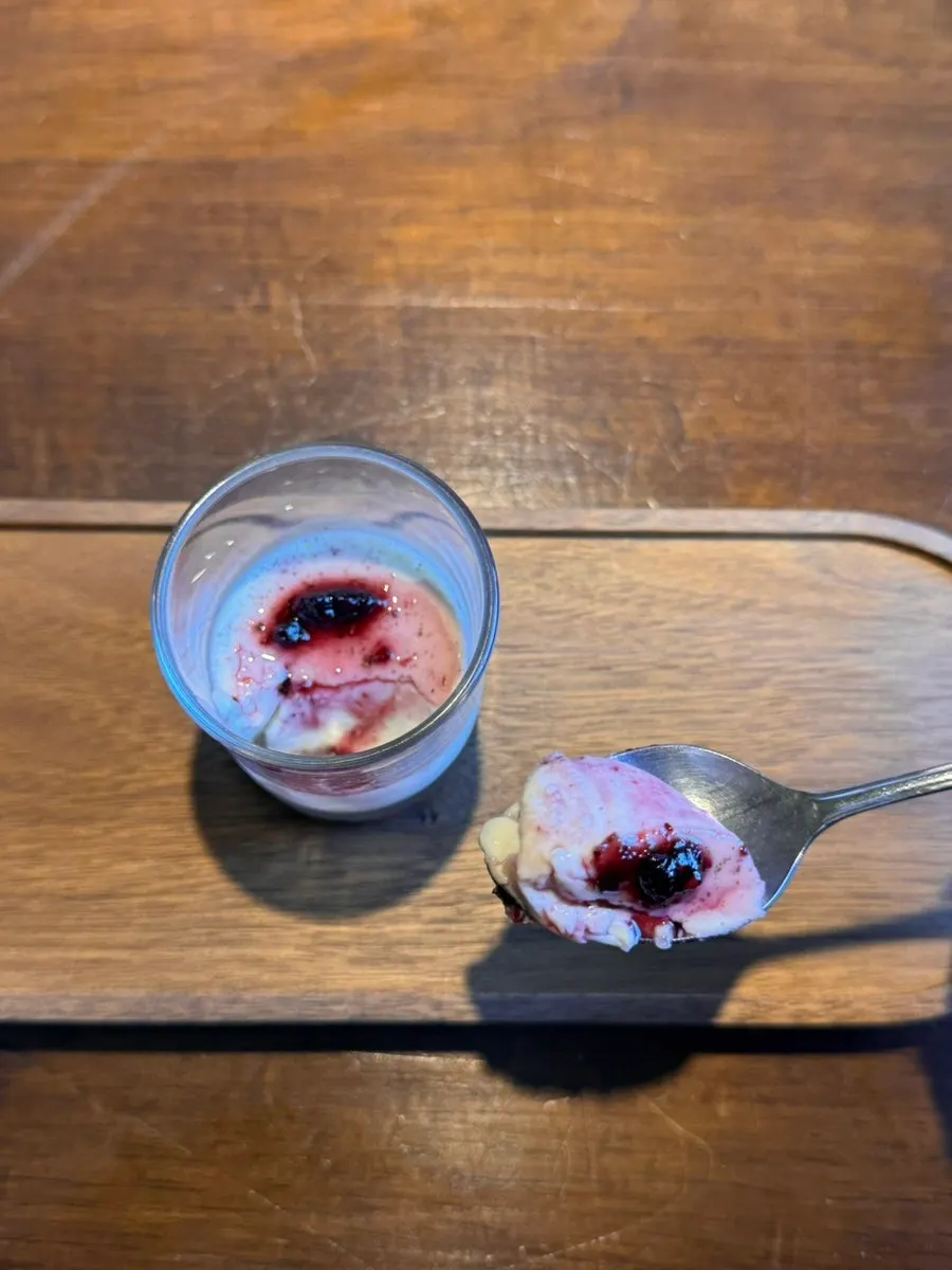 Panna cotta topped with Oreo cookie and blueberry compote