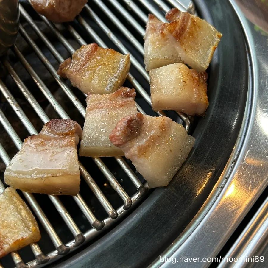 Thick slices of black pork on the grill