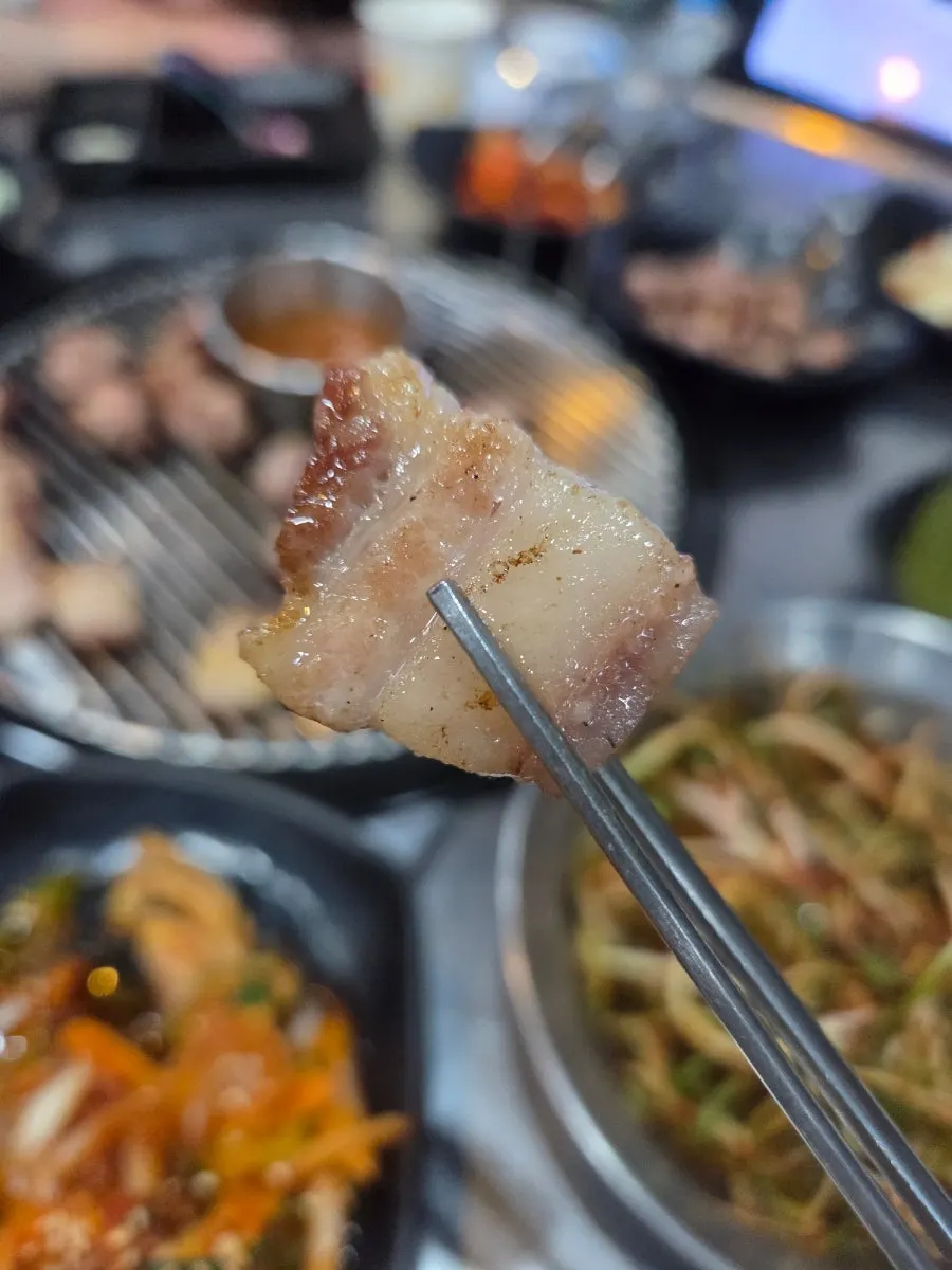 Black pork pre-grilled on charcoal briquettes