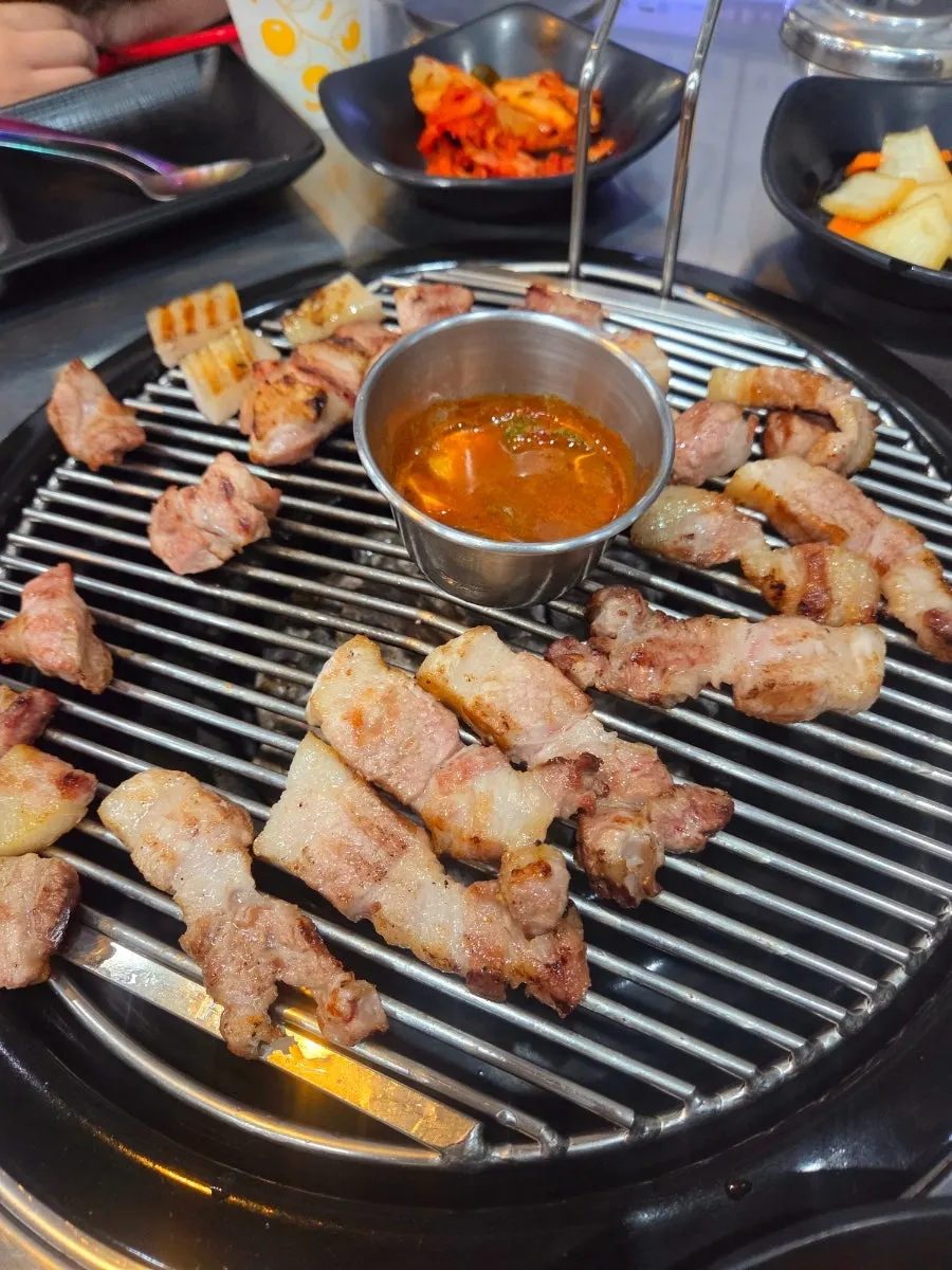 Black pork neck and belly on the grill plate
