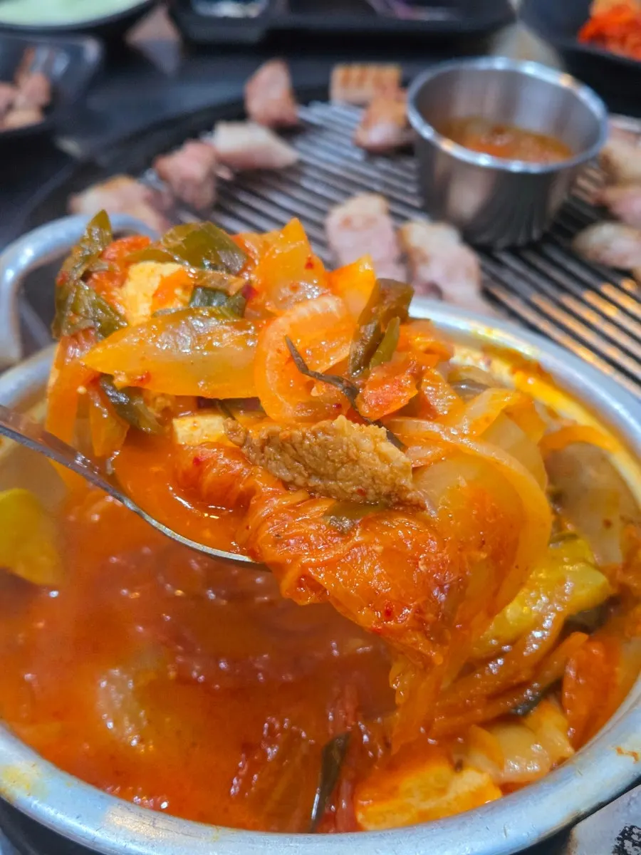 A bowl of kimchi jjigae loaded with meat