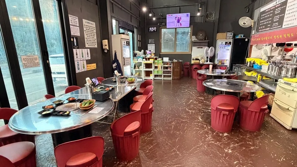 Restaurant interior with round charcoal tables