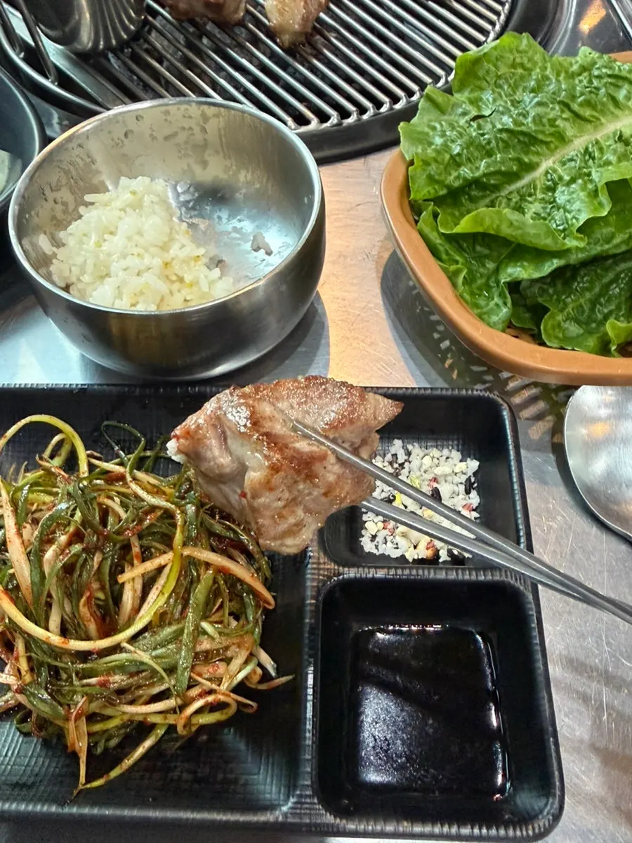 A piece of black pork dipped in salt