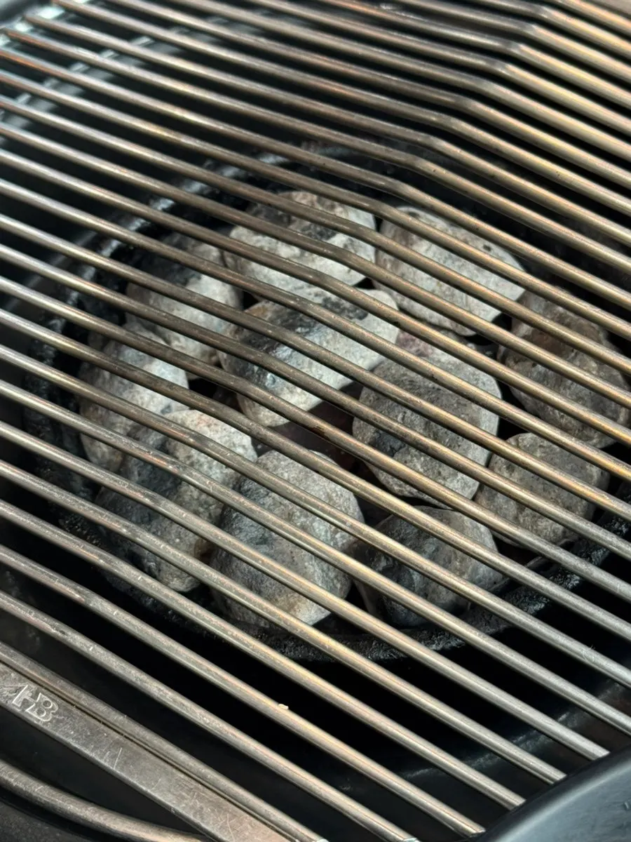 Sign explaining the charcoal and maifan stone grilling method