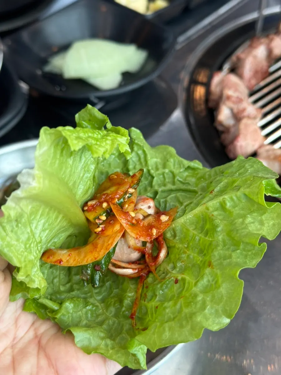 Lettuce wrap topped with black pork