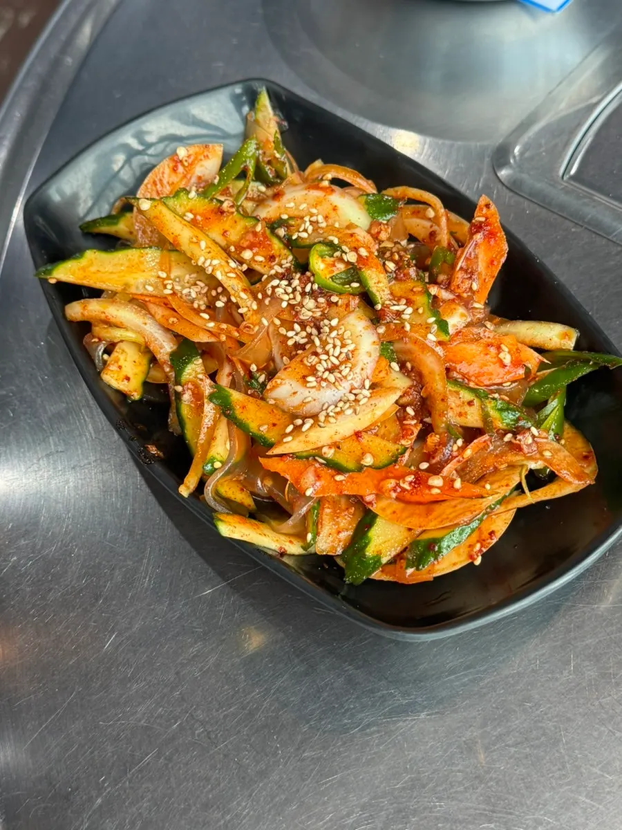 The cucumber glass noodle salad ordered alongside the meat