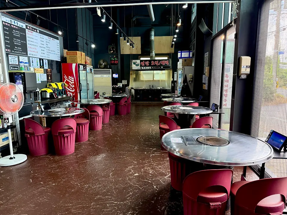 Interior with round charcoal tables