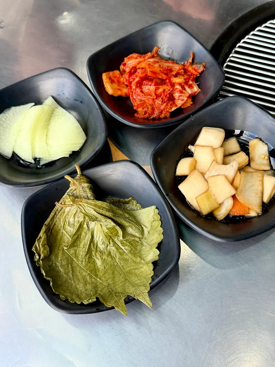 Plate of kimchi and pickled onion side dishes