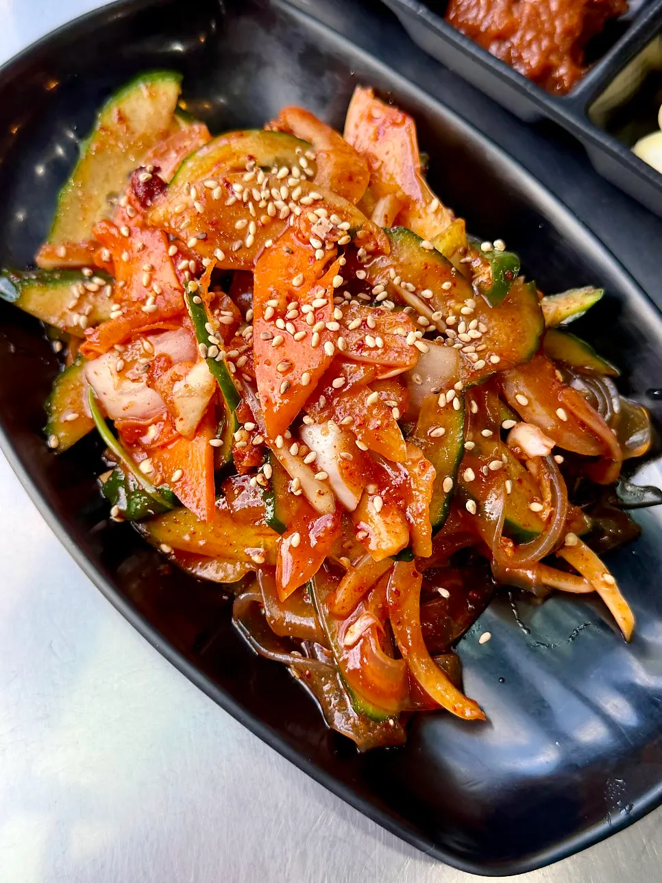 A plate of tangy cucumber glass noodle salad