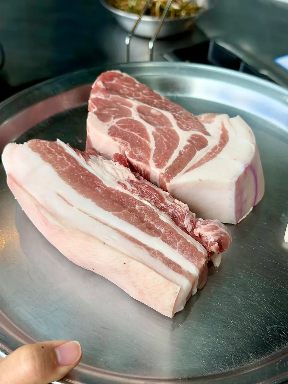 Thick-cut raw black pork belly and neck