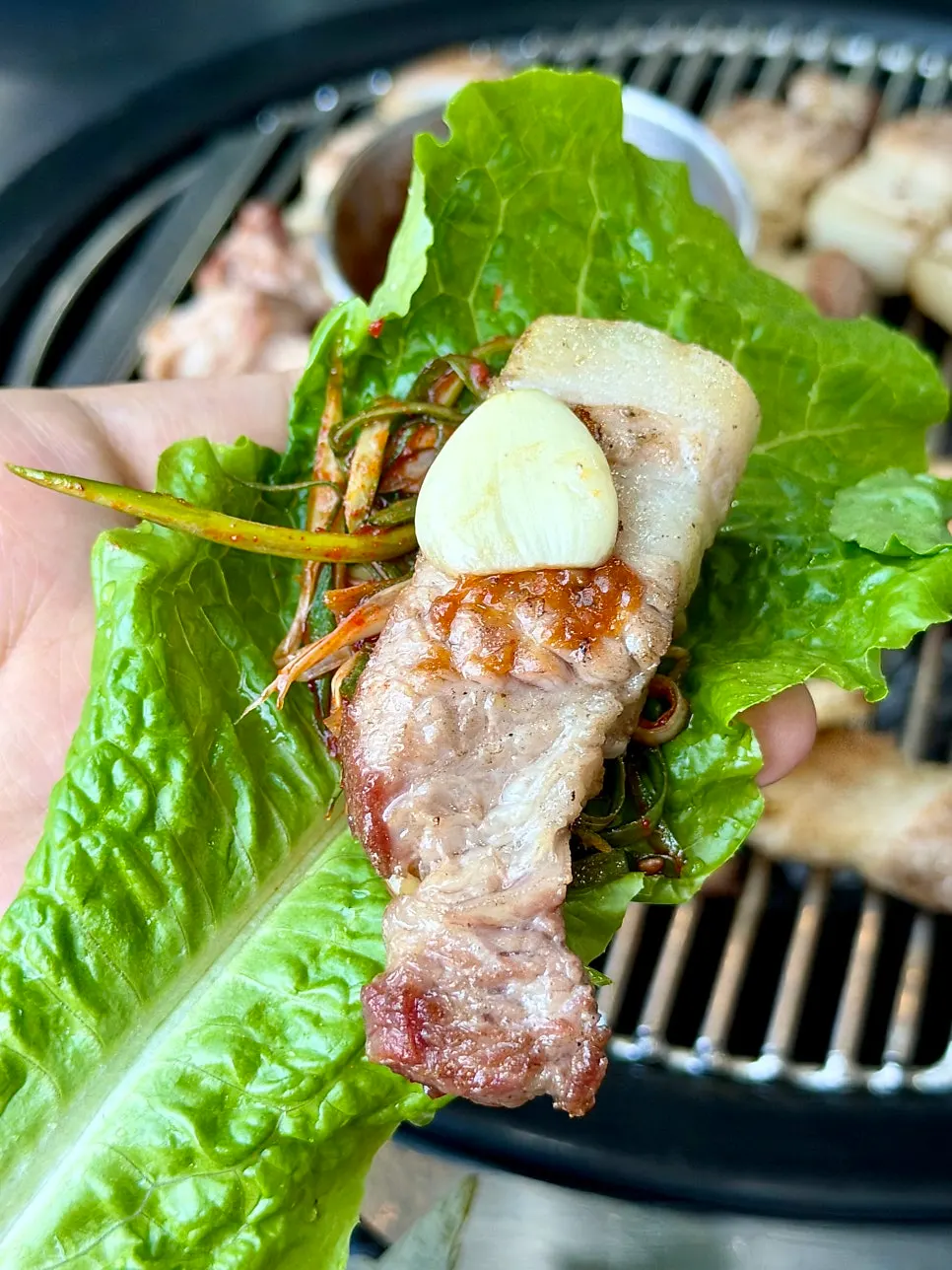 A piece of black pork dipped in maeljeot