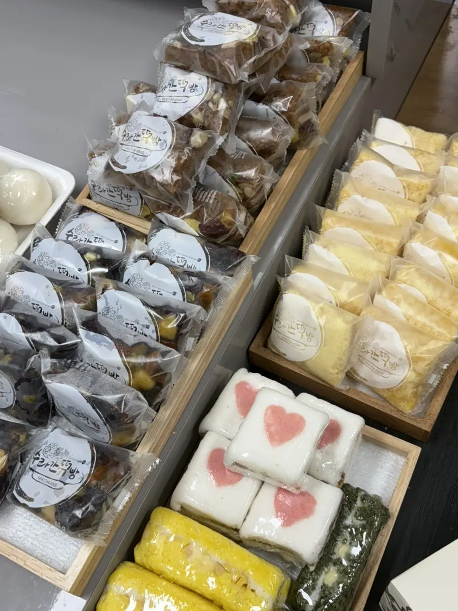 Assorted rice cakes displayed at Suragan Tteokbang