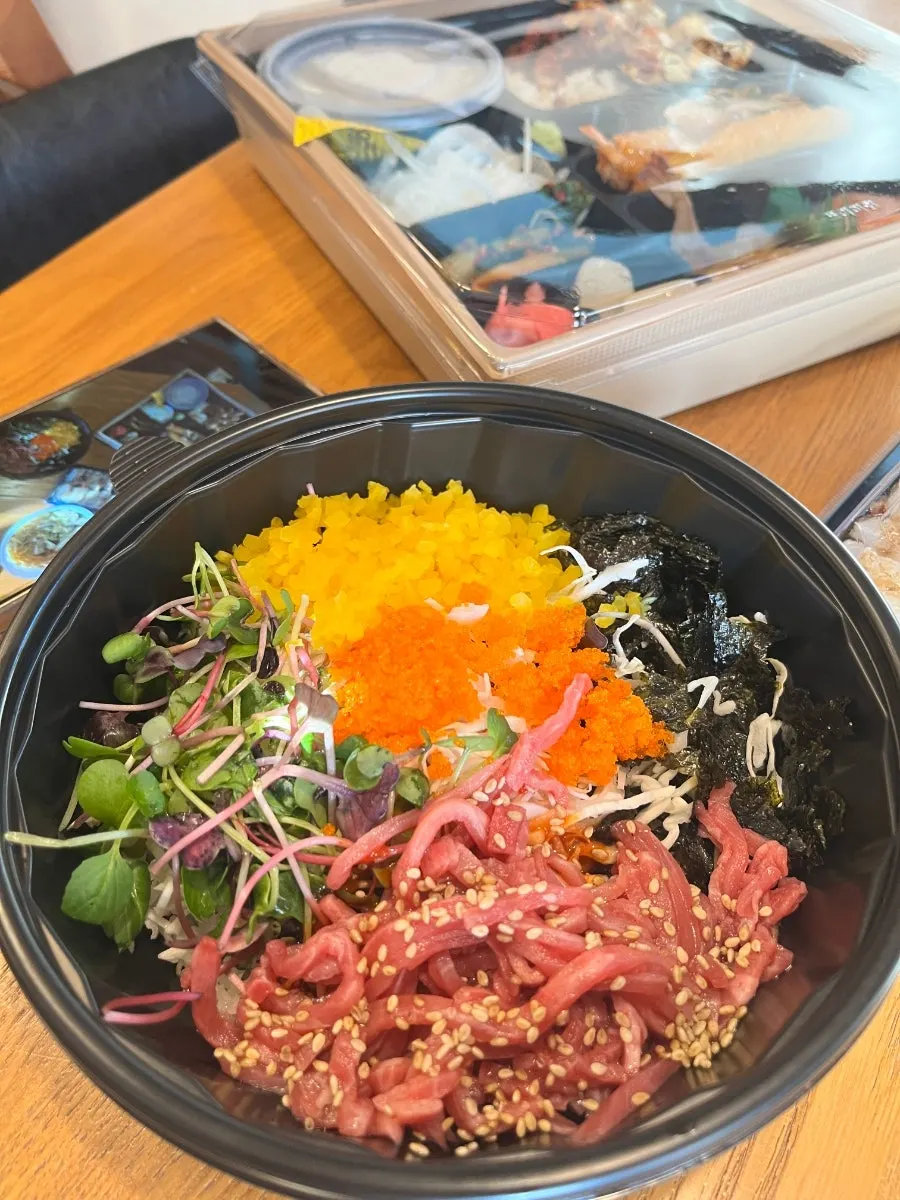 Packaged raw beef bibimbap and fried tofu udon set