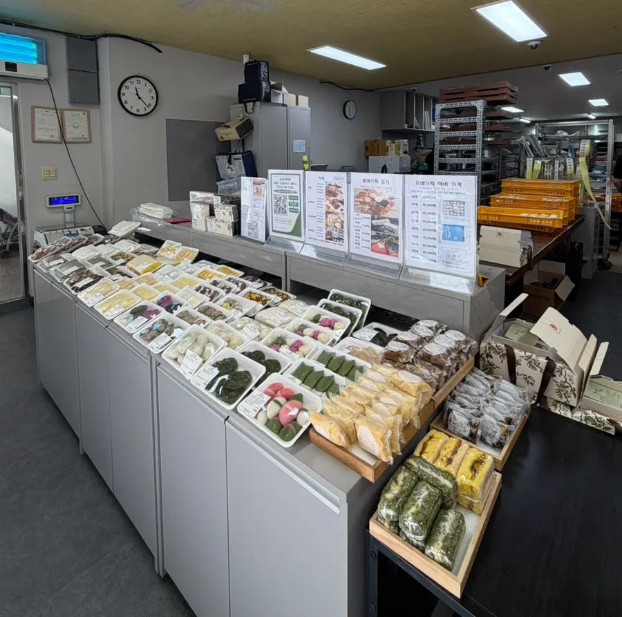 Inside Suragan Tteokbang with a display of assorted rice cakes