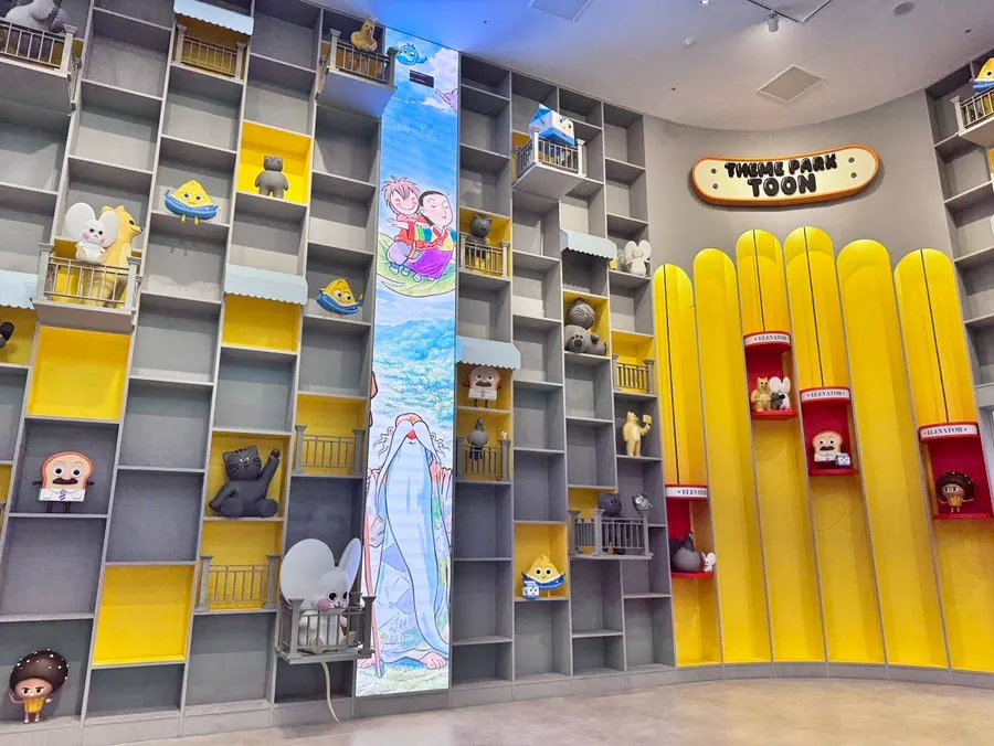 Indoor theme park entrance decorated with cartoon artwork