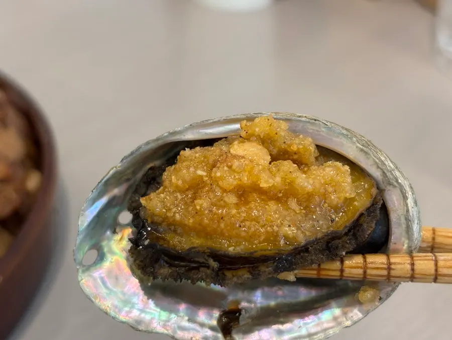 A crispy-fried piece of seafood pancake