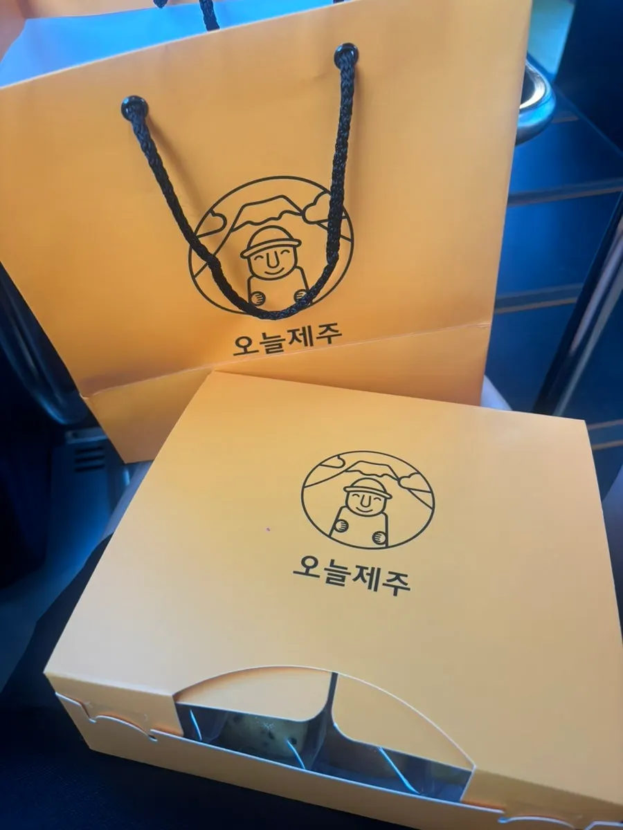 Individual Harubangne wrappers labeled hallabong, matcha, and other flavors