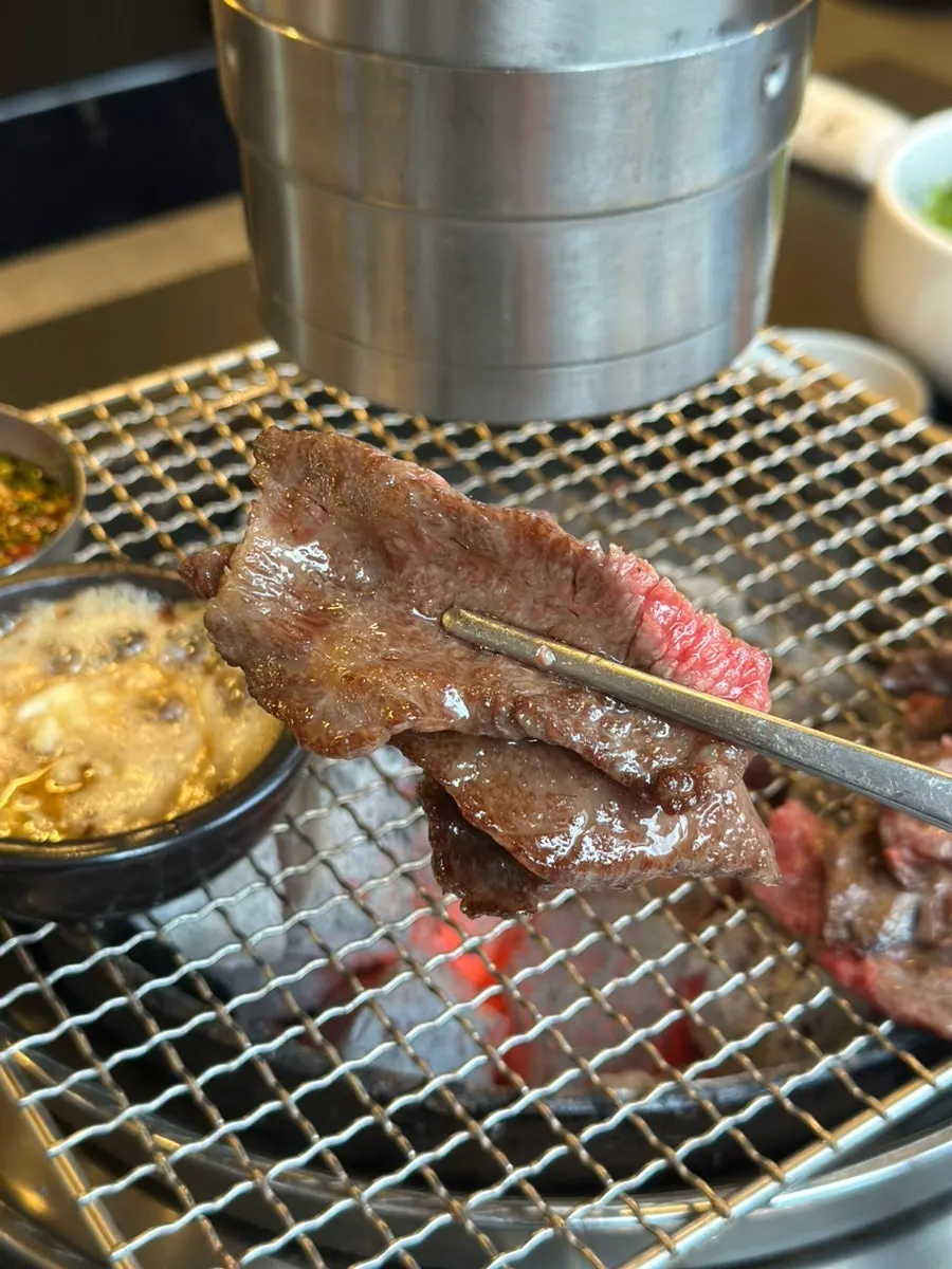 Manong galbisal grilling over charcoal