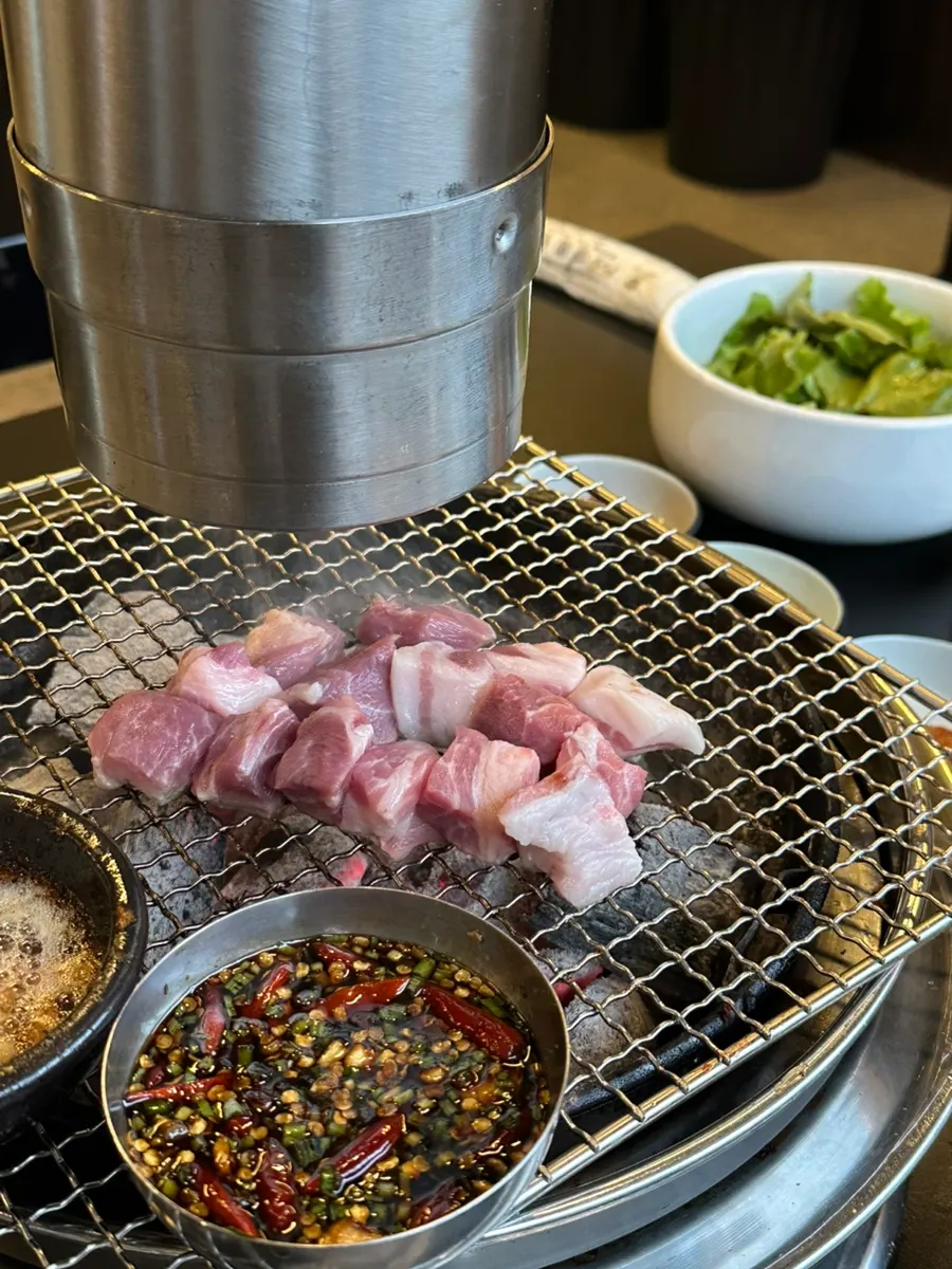 Kimchi served to top the grilled meat