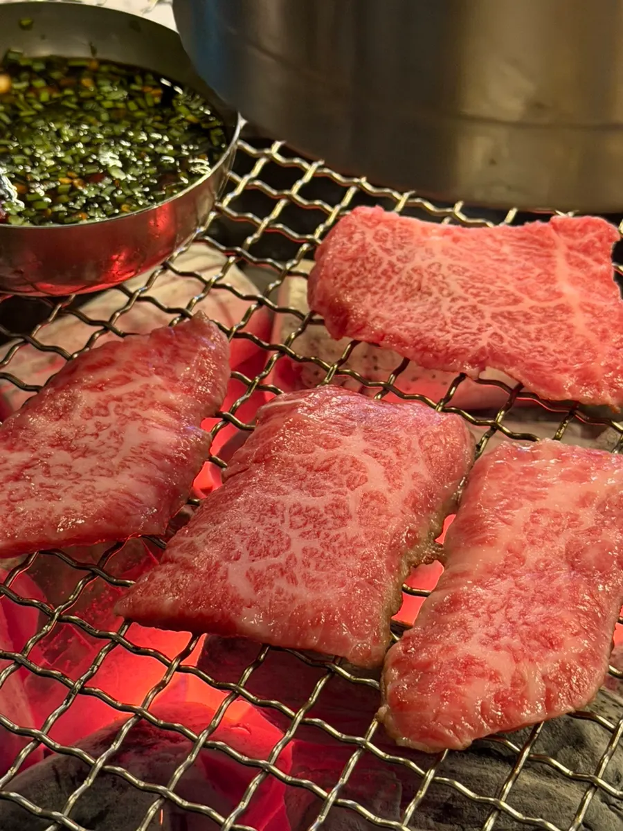 Skirt steak cooking on the grill plate