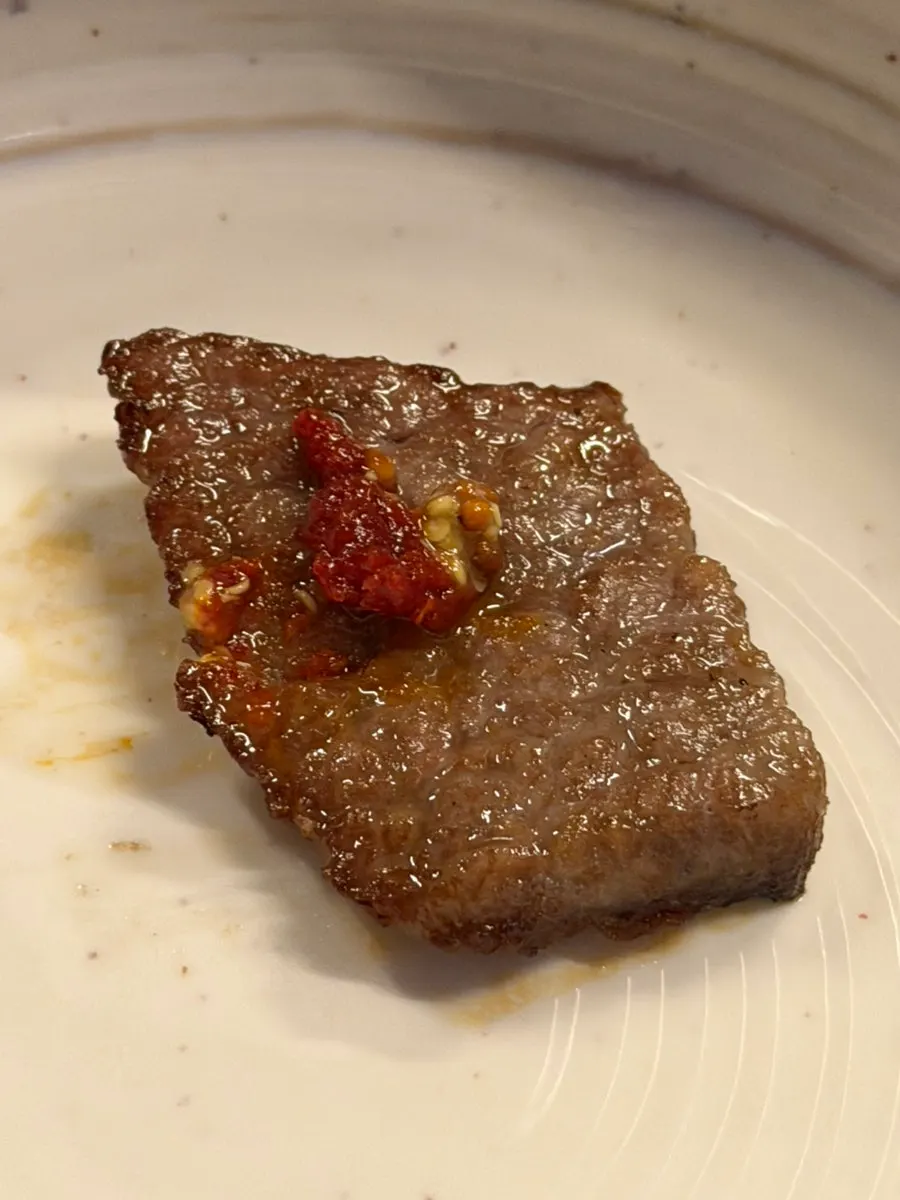 A bite of hanwoo dipped in salt
