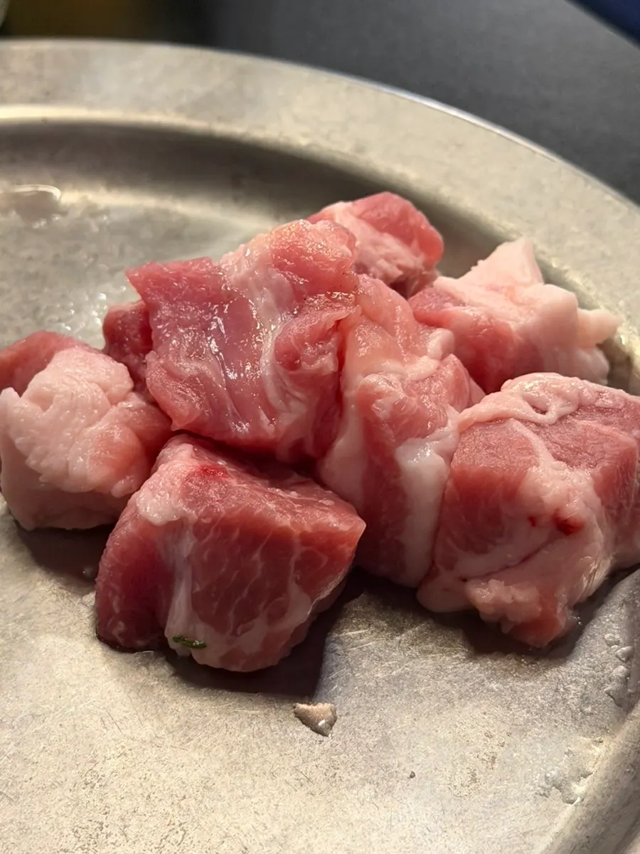Raw Jeju black pork cubed pork jowl
