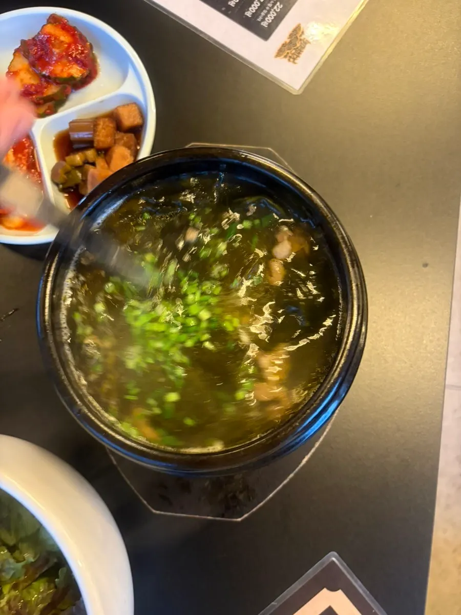Inside of the miyeokguk with scallions and garlic