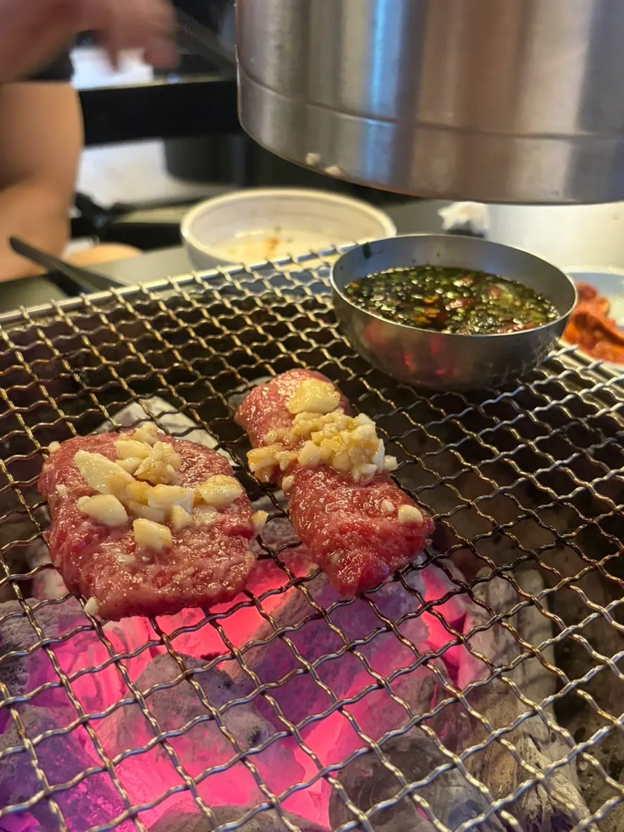 Manong galbisal grilling over charcoal