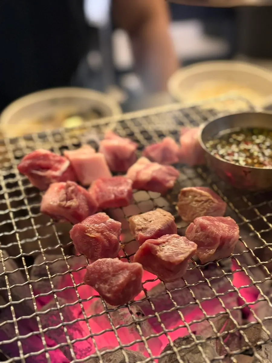 Raw black pork cubed pork jowl at Dolgyeok Hanwoo