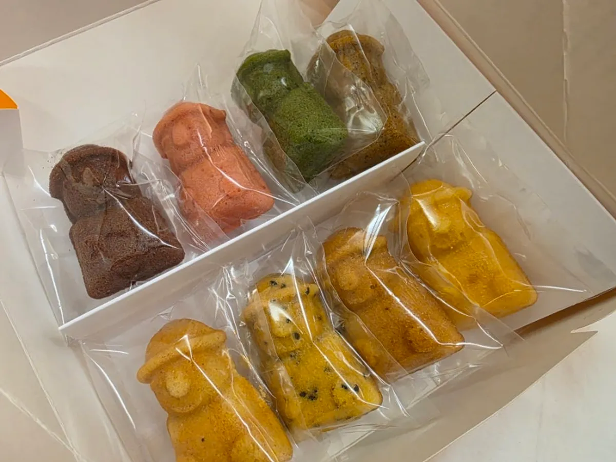 Eight flavors of dol hareubang madeleines neatly arranged in the box