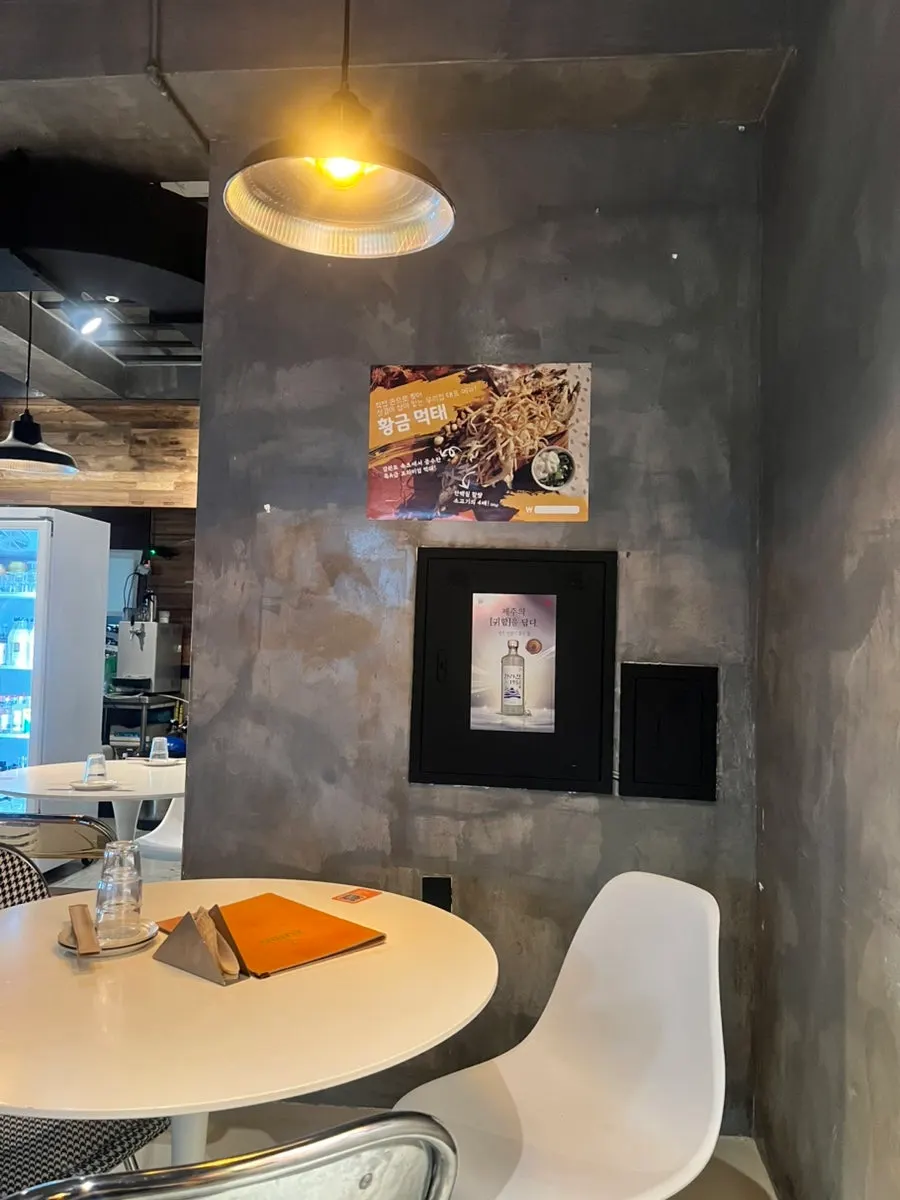 A screen playing a drama inside the bar