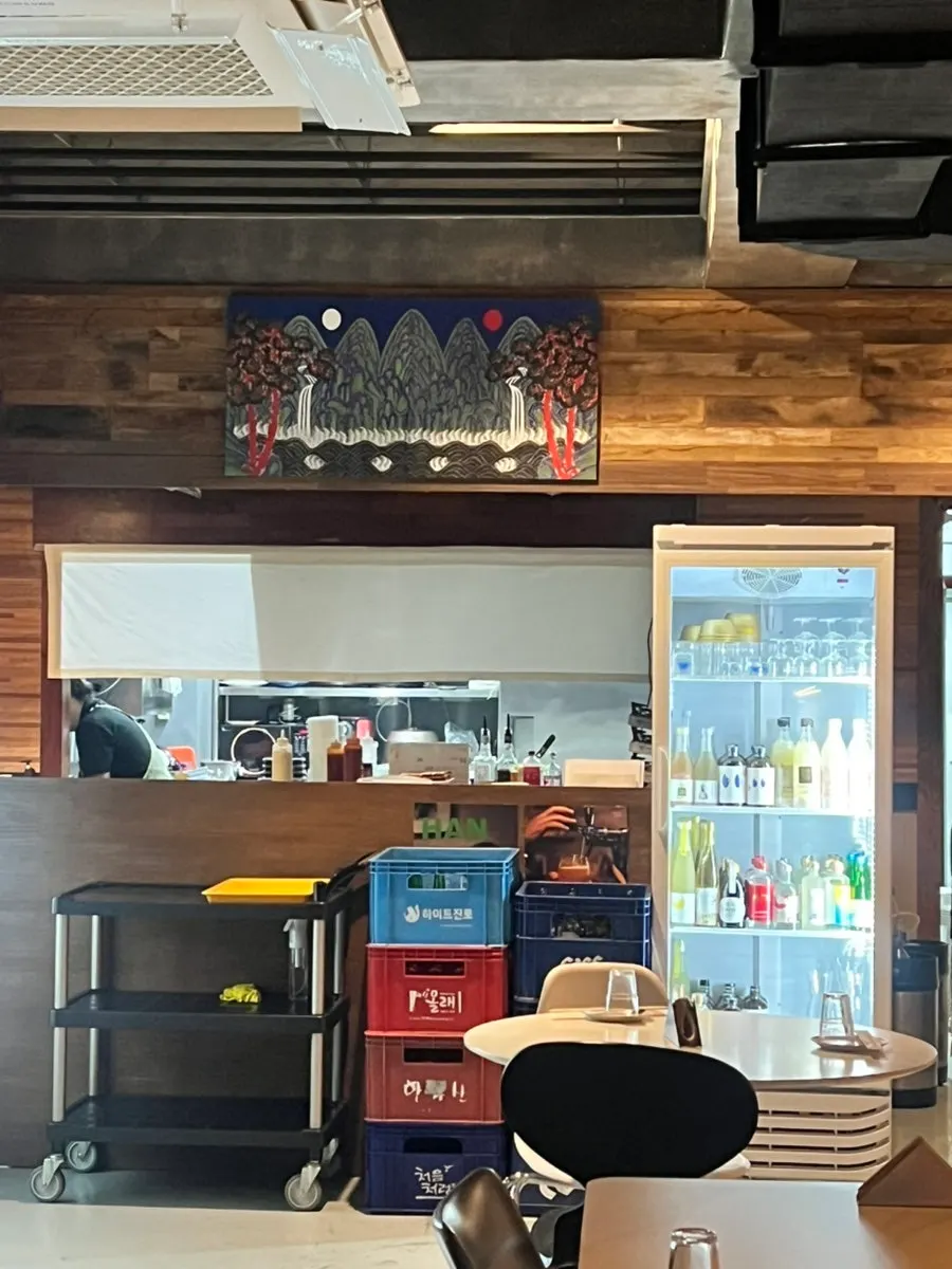 Shelf displaying liquor bottles at Jumo