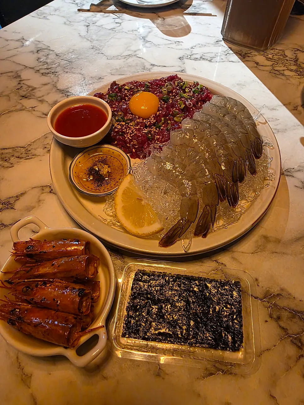 Table setup of the ordered beef tartare & shrimp platter