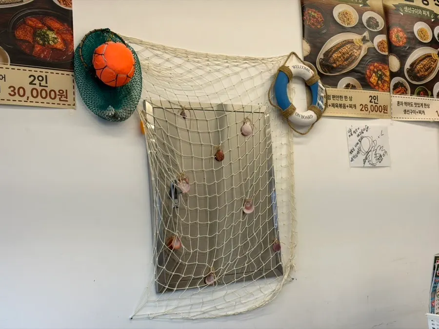 Corner of the restaurant decorated with ocean-themed props